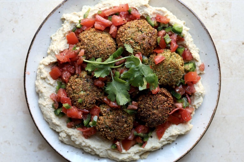 Falafel on Hummus With Chopped Peppers and Tomatoes